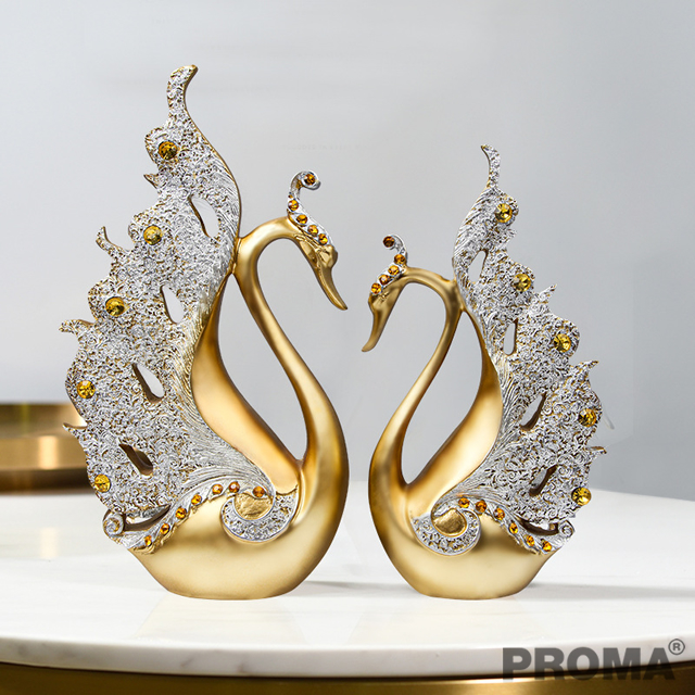 A Pair of Golden Swans Decorated with Amber Crystals.